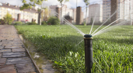 nozzle automatic watering system against a background of green g