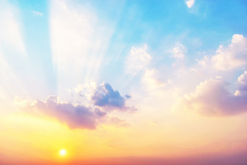 Wall Mural - Sky background at sunset,Sky blue and orange light of the sun through the clouds in the sky survive