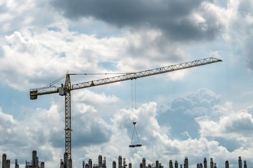 Crane with building construction site