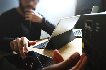 Poster - Website designer working digital tablet and computer laptop with digital tablet and digital design diagram on wooden desk and compact server