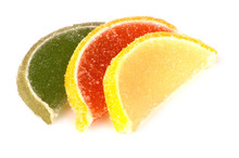 Marmalade In Form Of Slices Of Citrus Fruits On White
