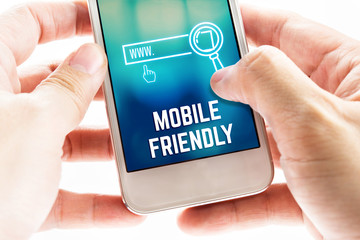 close up two hand holding mobile phone with mobile friendly and