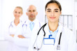© rogerphoto - Happy doctor woman  with medical staff at the hospital