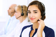 © rogerphoto - Call center. Focus on beautiful woman in headset