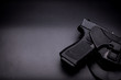 pistol in a holster in black background