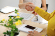 © rogerphoto - Young business woman shaking hands  after signing contract