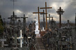 Catholicism religion landmark - The Hill of Crosses in Lithuania under heavy dark cloudy sky
