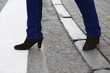 © jelenaaloskina - Safe crosswalk - Woman legs in jeans and shoes on high heels entering to pedestrian crossing side view