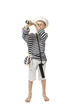 Young boy in sailor hat and frock looks through telescope isolated on white background - adventure and travel concept