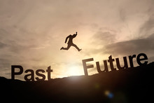 Silhouette Of Businessman Glowing Jump Past To Future. Success C