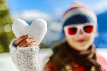 Wall Mural - I love winter. Happy winter girl wearing knitted wear scarf. Exc