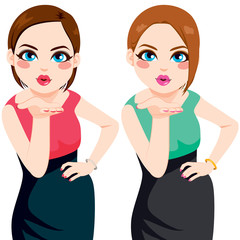 Wall Mural - Two beautiful women blowing kiss posing with hand on hip wearing dress of different color style