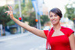 © Sergey Nivens - Businesswoman trying to catch a taxi