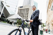 © Sergey Nivens - Young businessmen with a bike