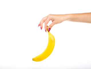 A girl holding a banana with your fingertips on a white backgrou