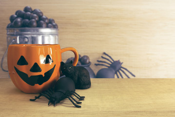 halloween coffee cup with spider and cat and chocolate spider background