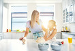 © Flamingo Images - Loving mother and daughter baking in the kitchen