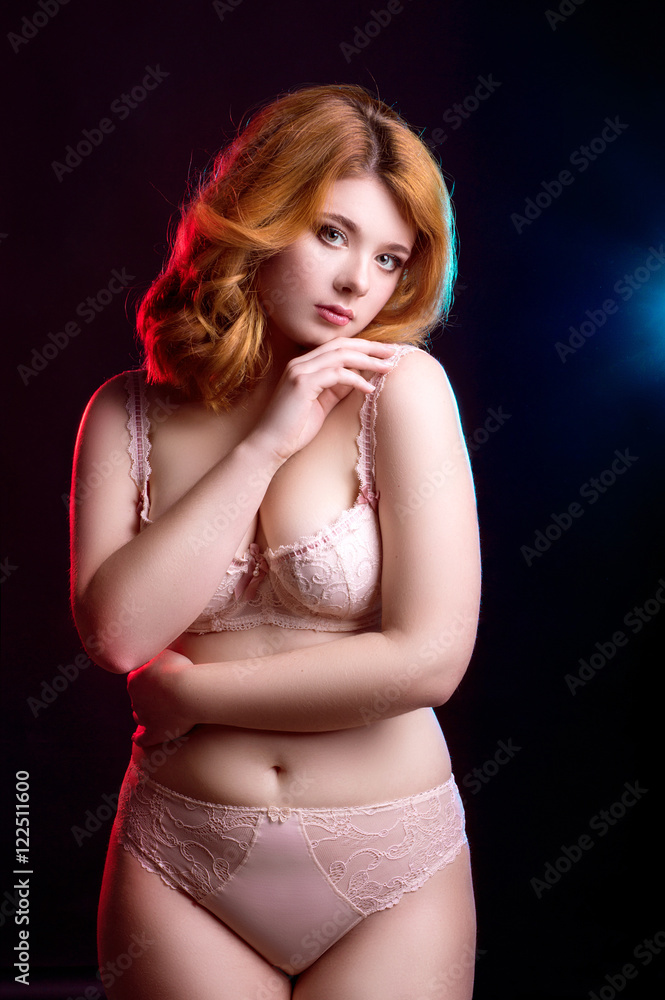 Hot redhead blue-eyed model in lingerie posing in the studio Stock Photo |  Adobe Stock