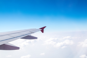 Wall Mural - Aerial view of cloud and sky and land with airplane wing from ai