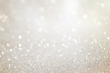 Silver Glittering Christmas Lights. Blurred Abstract Holiday Background