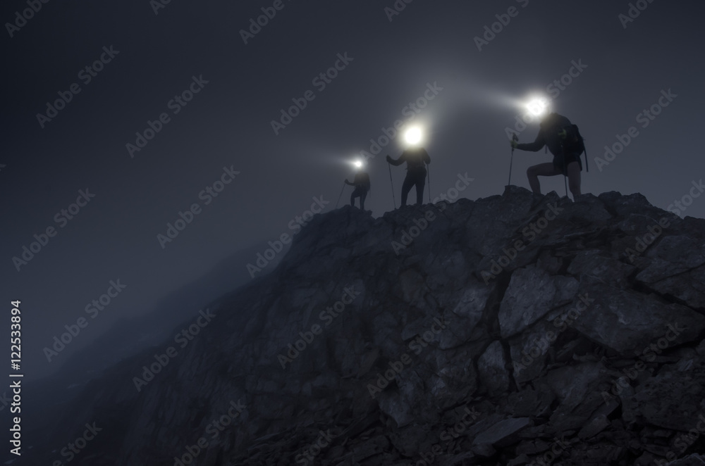 Lightbeams in the darkness on mountain ridge - obrazy, fototapety, plakaty 