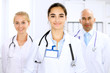 © rogerphoto - Happy doctor woman  with medical staff at the hospital