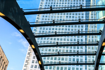 High buildings in Canary Wharf, London through rooftop of station entrance