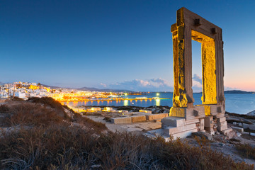 Canvas Print - View of Portara and remains of temple of Apollo at sunset.