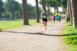 © Alextype - runners in marathon in a park abstract, blurry