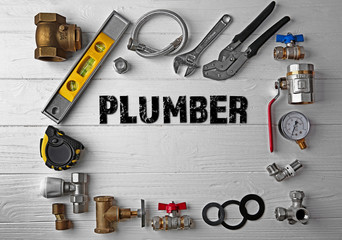 Wall Mural - Plumbing concept. Plumber tools frame on white wooden background