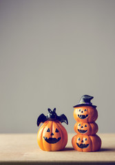 Happy Halloween, Two Pumpkin on table wood with gray wall background, halloween concept. Copy space. retro effect.