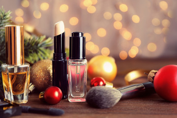 Wall Mural - Colorful makeup cosmetic with Christmas decoration on wooden table