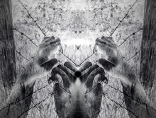 Artistic Surreal Tortured Hands Grasping Desperately Barbed Wire (infrared)