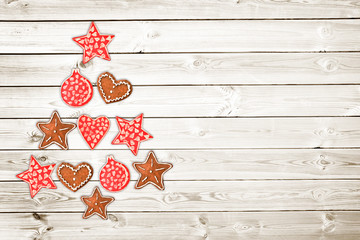 Wall Mural - Christmas tree made of wooden rustic ornaments on white wooden planks background