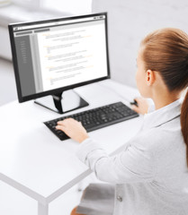 businesswoman with coding on computer at office