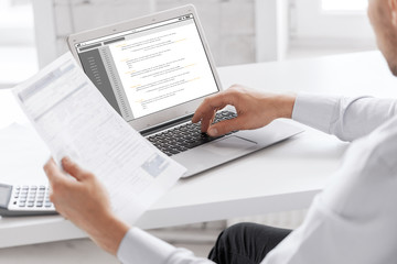 businessman with laptop computer working at office