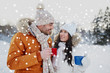 © Syda Productions - happy couple with tea cups over winter landscape
