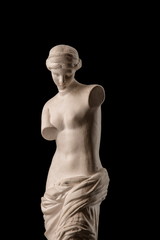 Venus statue on a black background