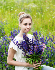 Poster - girl with bouquet of lupine flowers