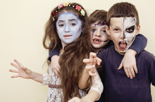 Zombie Apocalypse Kids Concept. Birthday Party Celebration Facepaint On Children Dead Bride, Scar Face, Skeleton Together