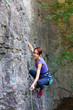 © zhukovvvlad - The girl climbs the rock.