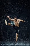 Fototapeta Sport - Water drops around football player
