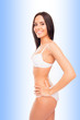 © deagreez - Side view photo of cheerful smiling young woman in white lingeri