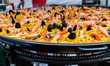 Seafood paella in a paella pan at a street food market
