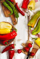 Sticker - Variety of fresh organic peppers on wooden background