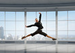 © Sergey Nivens - Dancing businesswoman in office . Mixed media