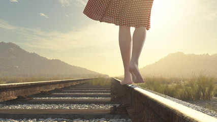 Wall Mural - a walking barefoot girl on the railway