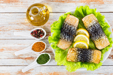 Poster - baked fillet of mackerel on lettuce salad on white platter