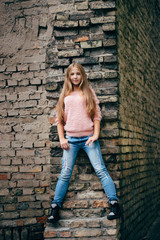 Wall Mural - beautiful young girl posing on the street