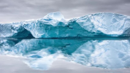 Wall Mural - big glacier in the snow with reslection in water. slow motion 4k footage